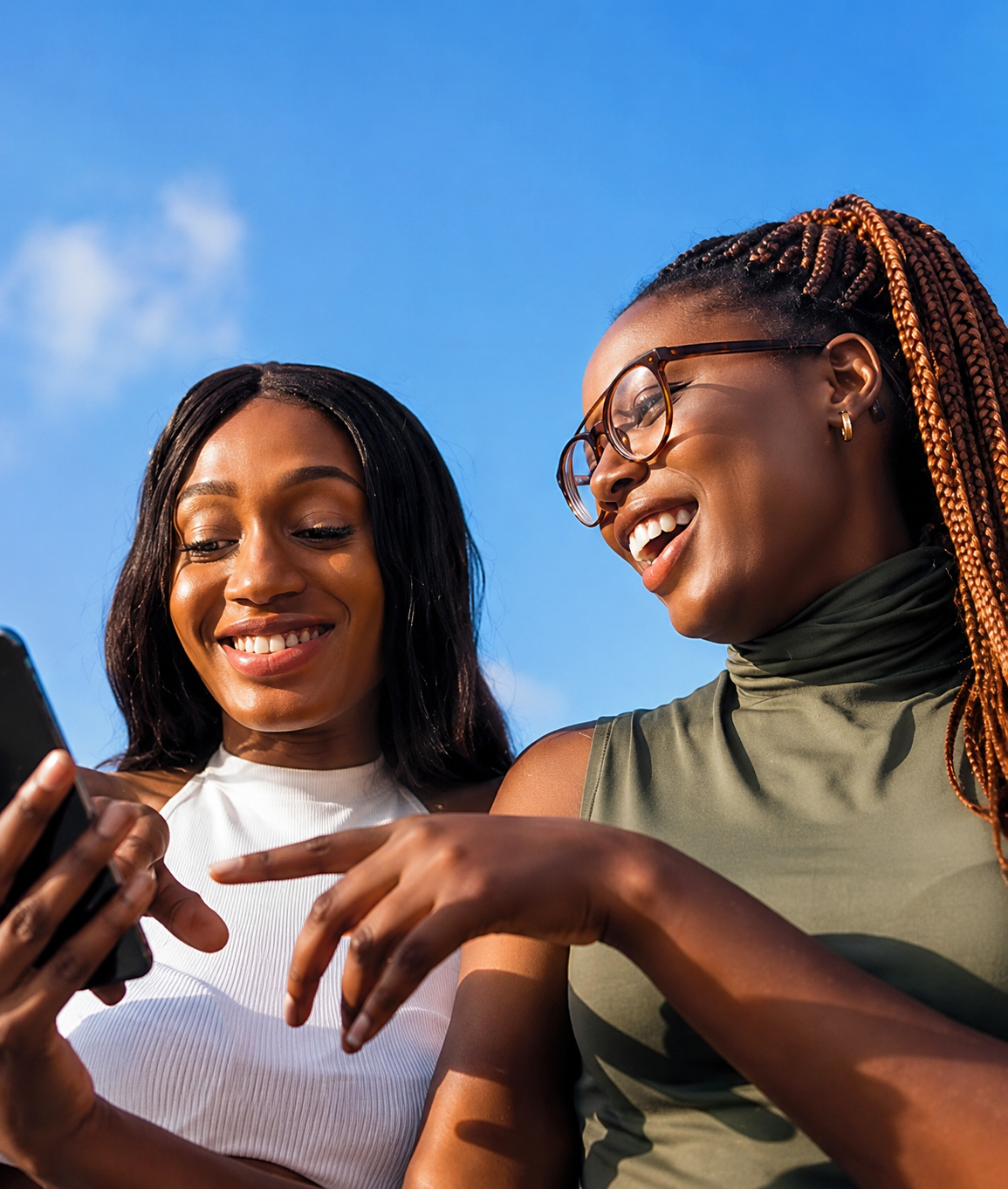 Two people checking a verification code on a phone